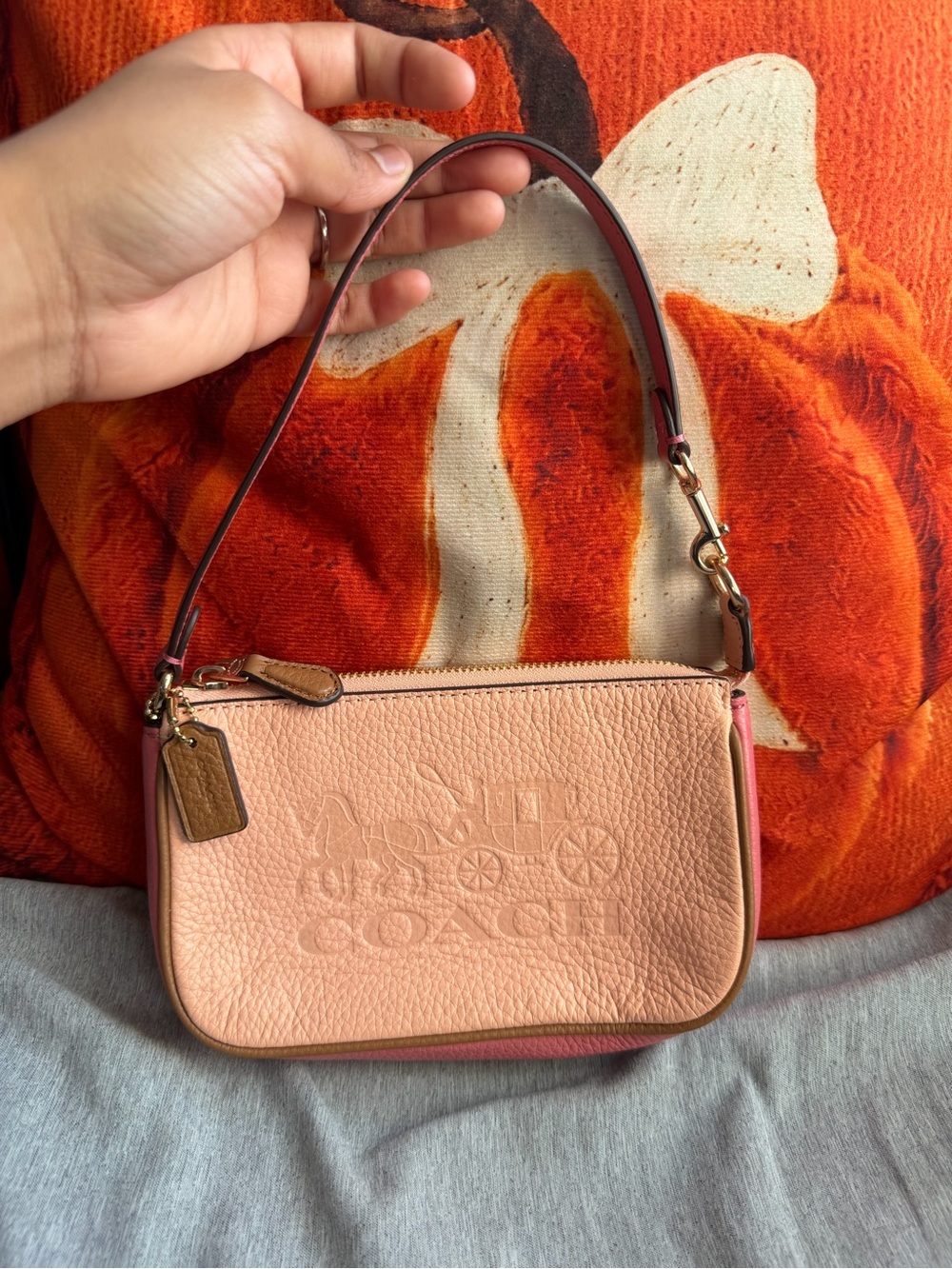 Coach Pebbled Leather Mini bag in Peach and Pink